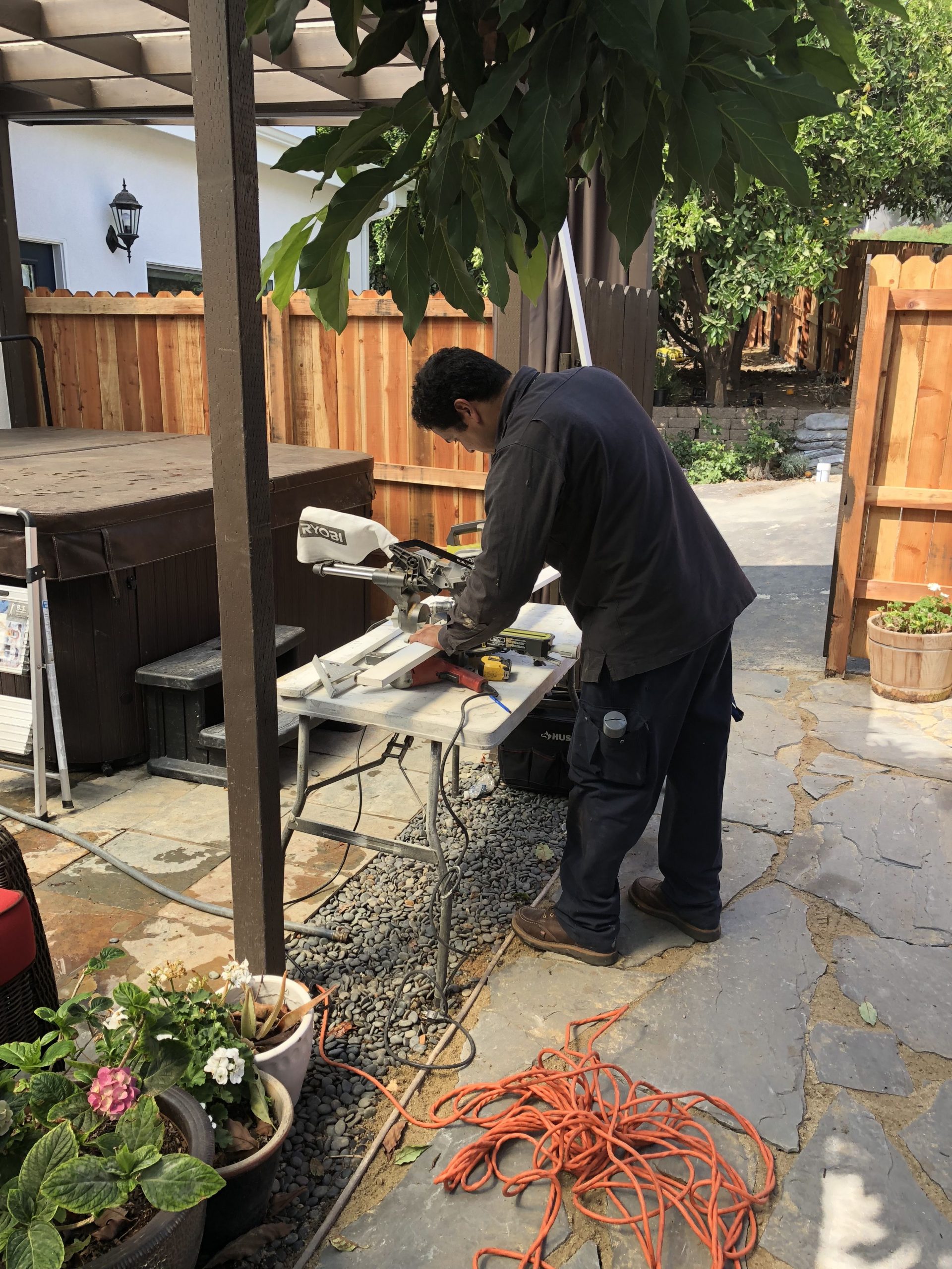 American Rat Control Technician Building a sub-crawl door on a work bench