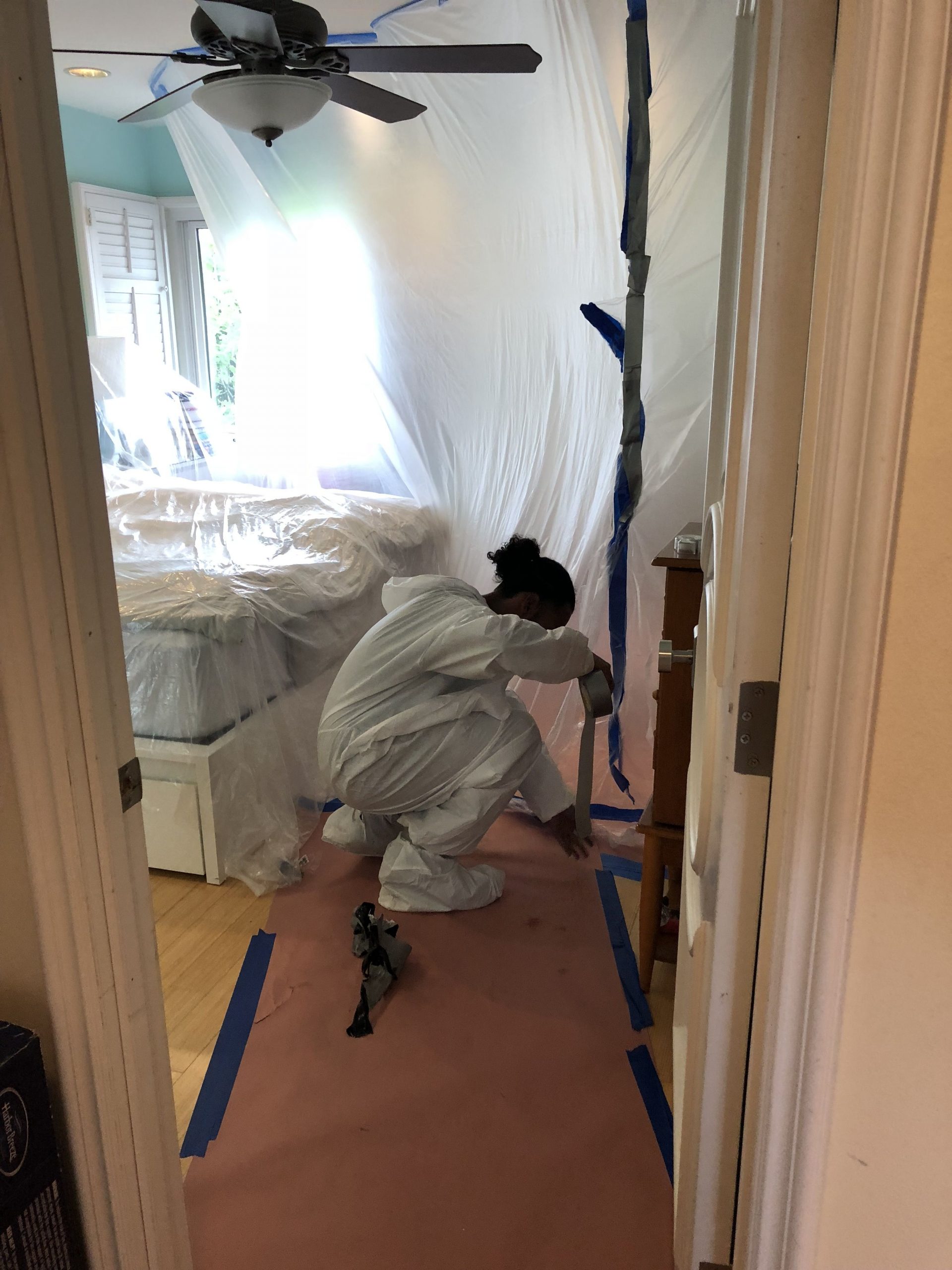 Rat exterminator employee sealing off an areas to prevent rodent contamination